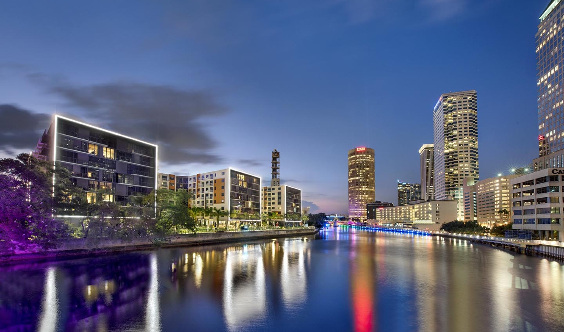 Twilight Image of Community and Downtown on River