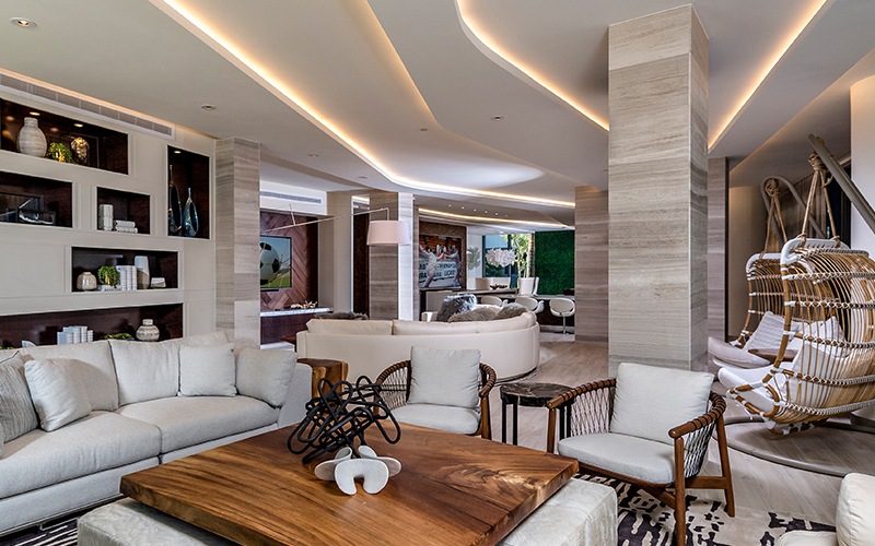 lounge room with modern decor, ample seating and white couches