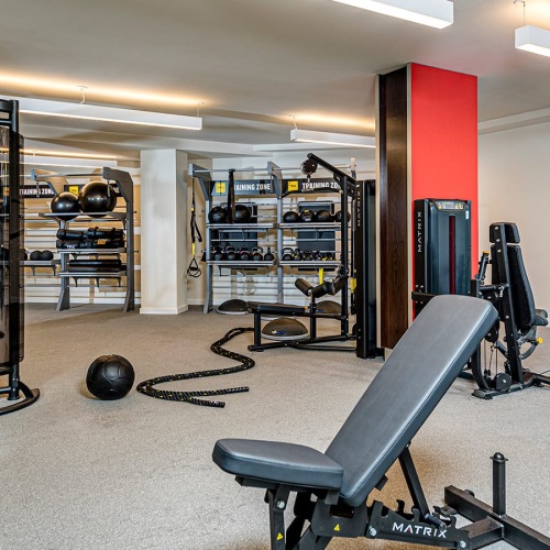 24 Hour Fitness Center fitness center showing plenty of equipment and modern decor in a large, spacious room