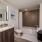 bathroom with modern finishes, a closet and ample counter-space