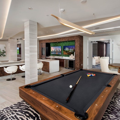 Game Lounge lounge with modern decor, a pool table and ample seating