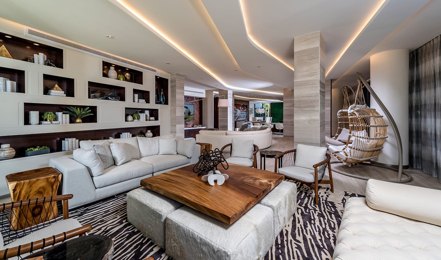 Living Begins Here modern lounge with modern decor, comfortable seating and ample room